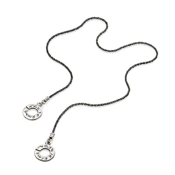 Open necklace. The element of the necklace is two flat circles with an engraving on them. In the picture the two circles are separate from each other